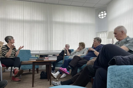 People sitting in a group talking