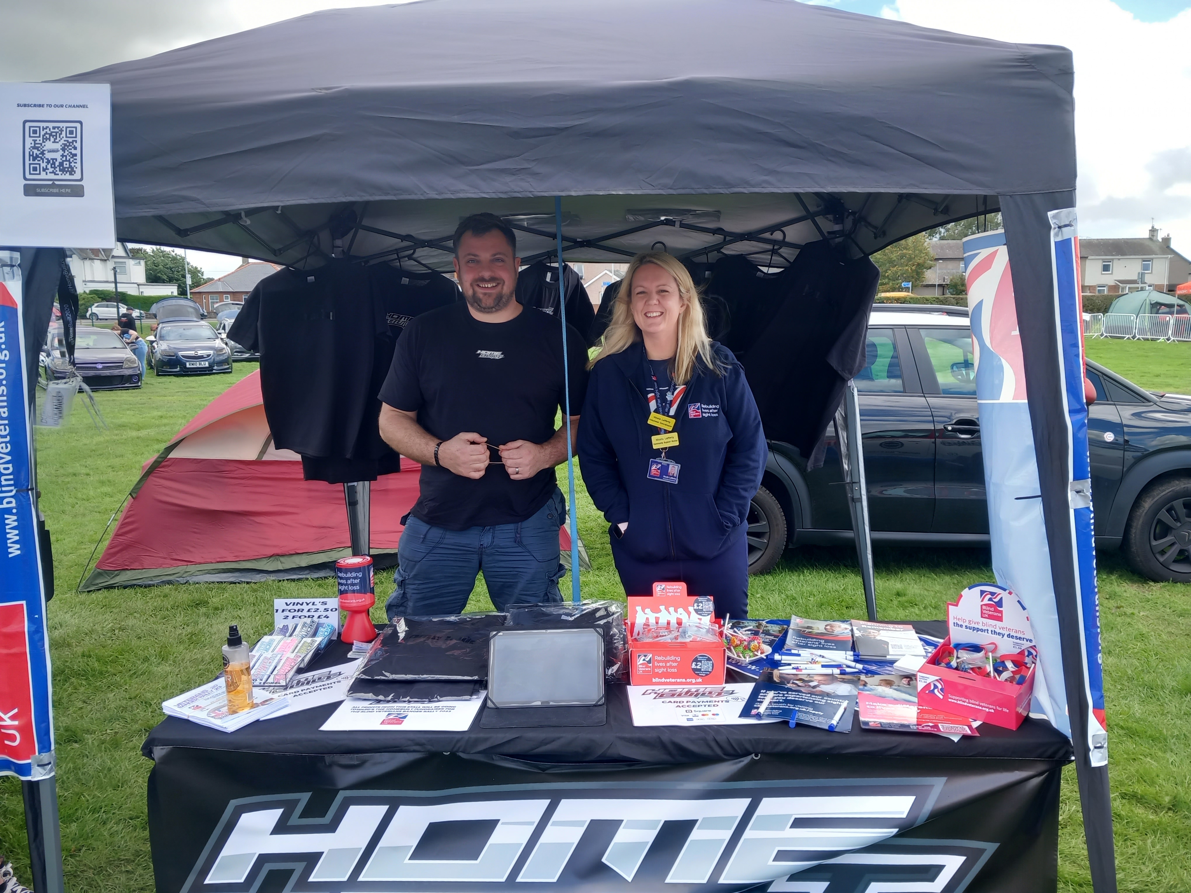 Nicola and Stevie stood next to each other at their joint information stand for the banger rally and Blind Veterans UK