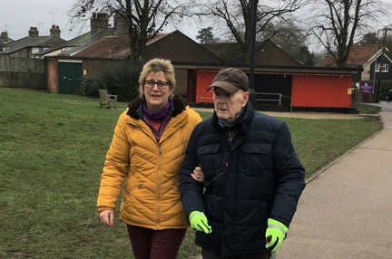 Blind veteran Colin and his daughter, walking laps around a park to raise money