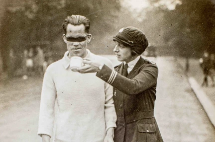 Photo of blind veteran, James Ingram, racewalking with guide
