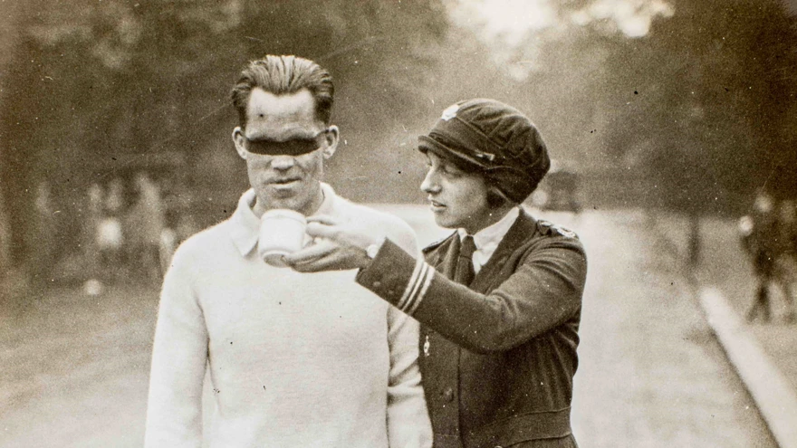 Photo of blind veteran, James Ingram, racewalking with guide