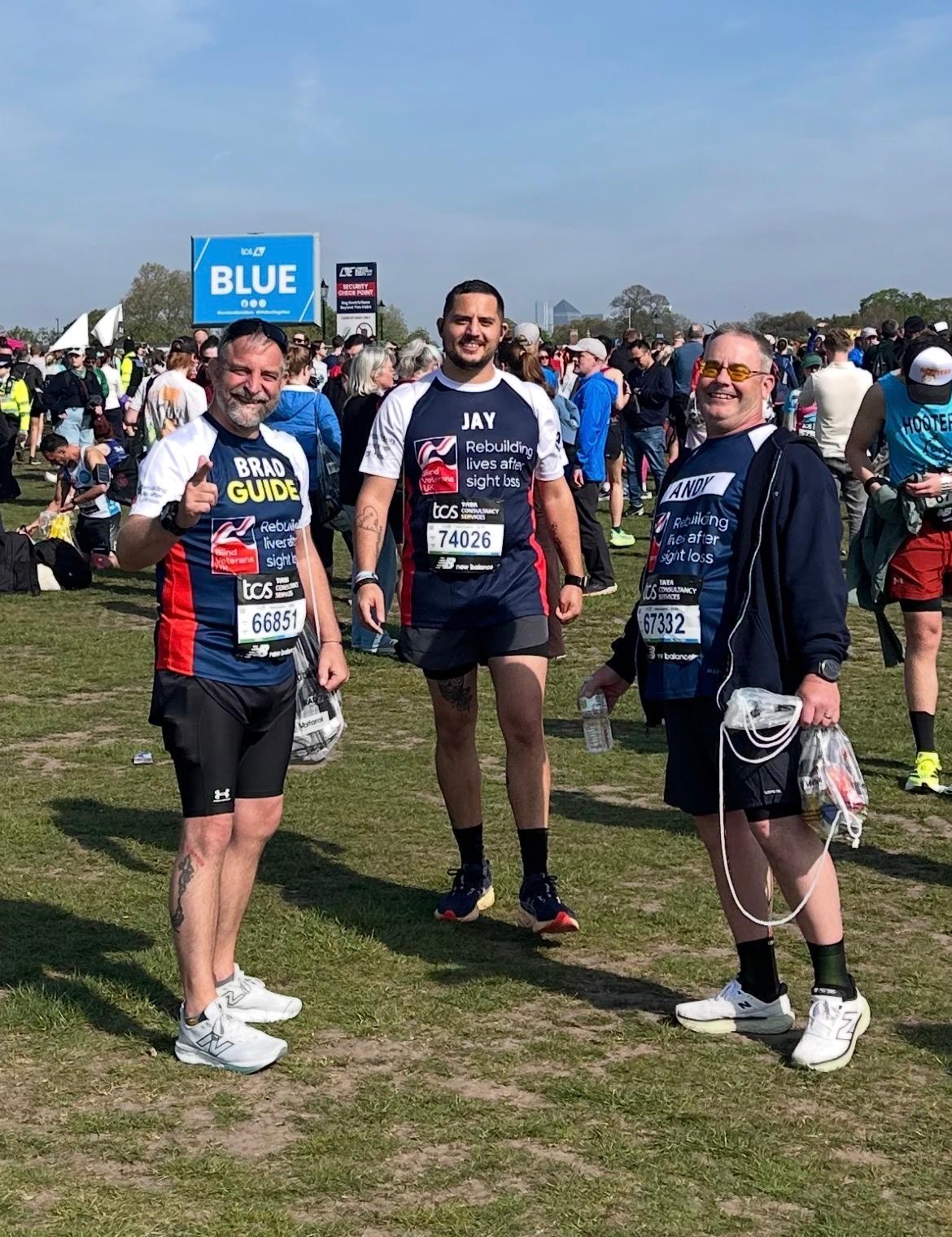 Andy, Jay and Brad are all smiling as they stand in a field ready to get going.