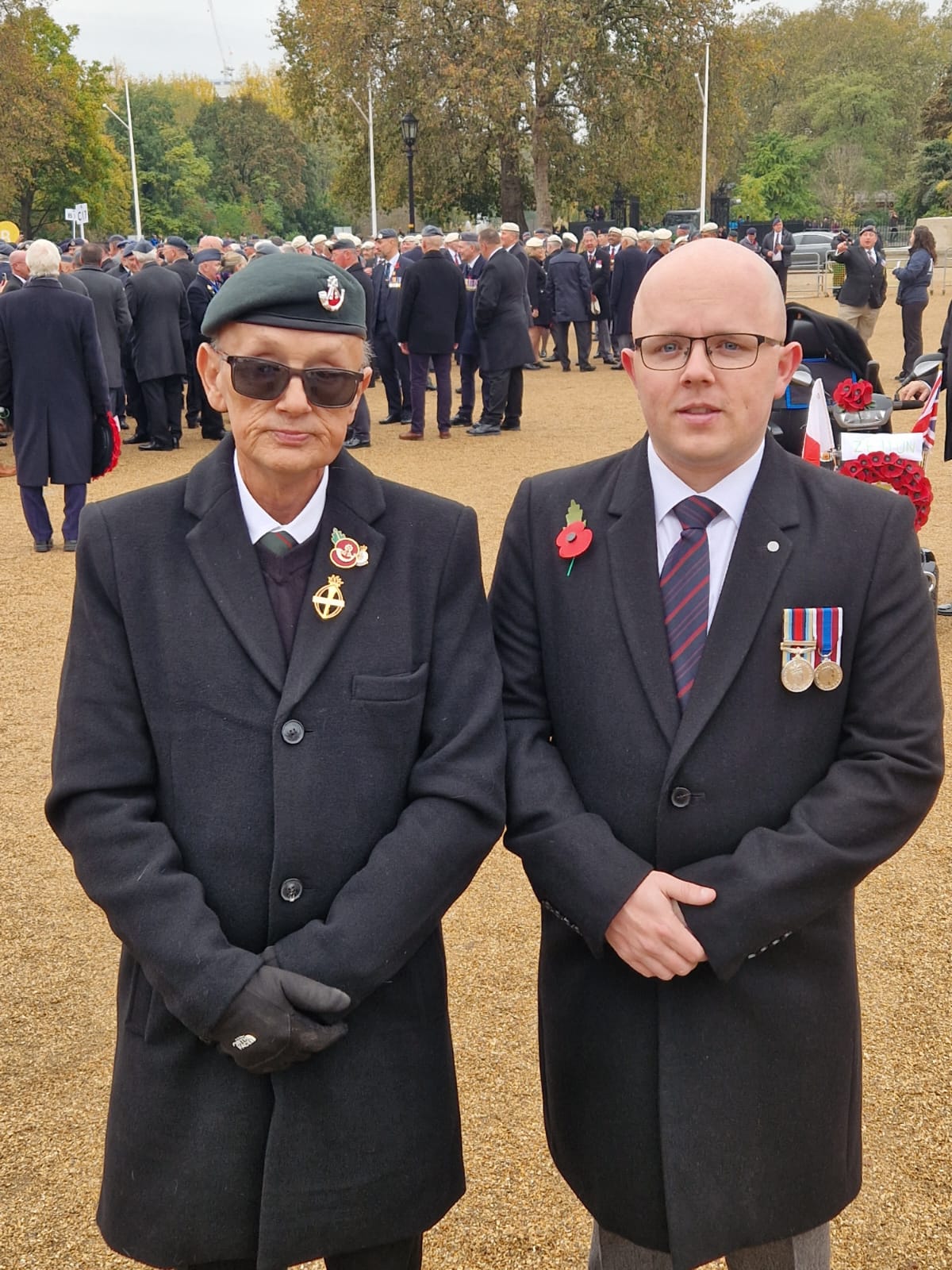Blind veteran Mark and son Ben on Remembrance Sunday just before the march