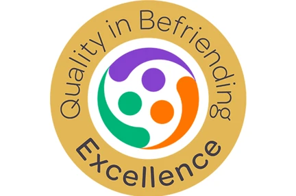 An image showing our badge for Quality in Befriending award from the Befriending Networks
