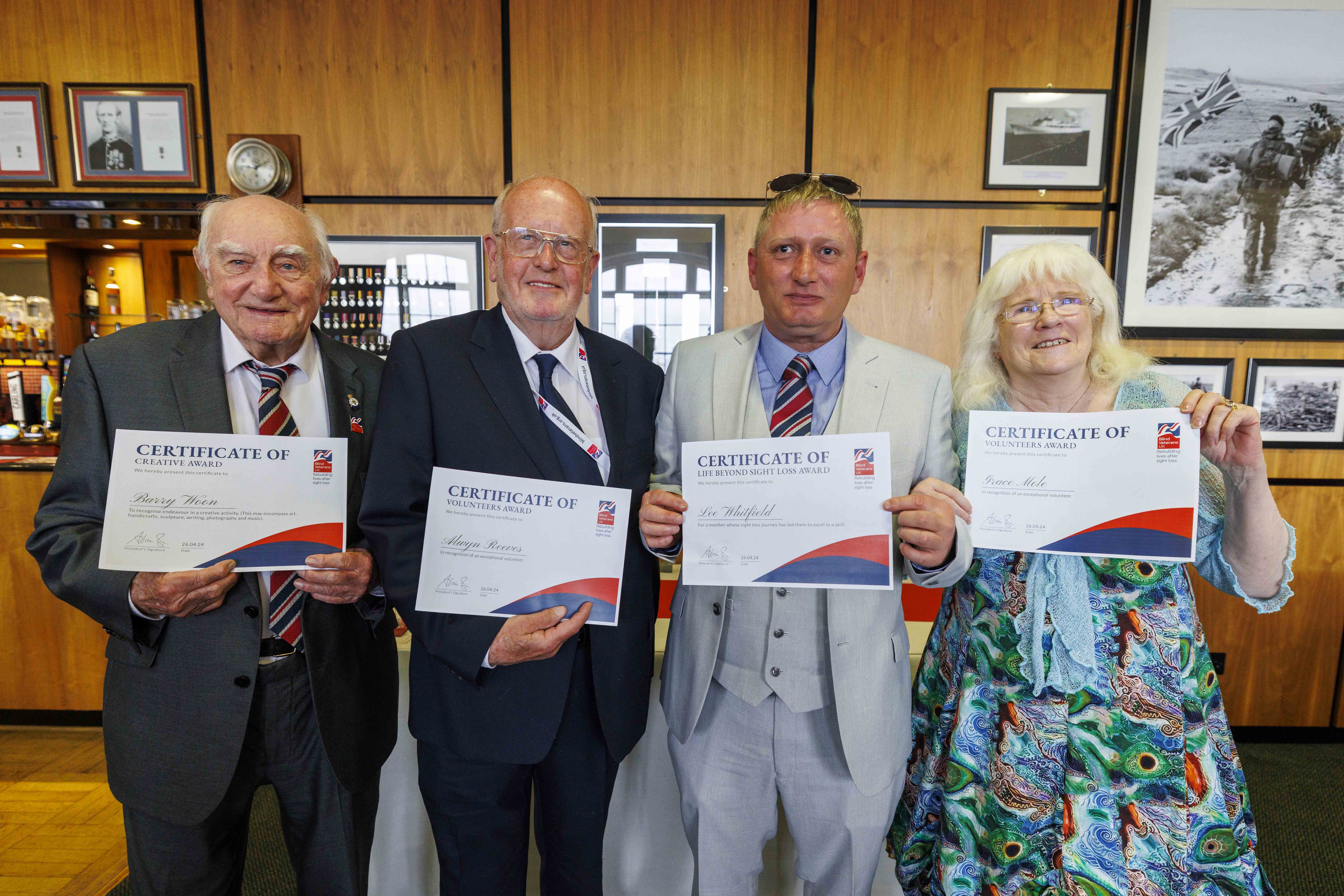 Founder's Awards winners holding their certificates at the HMS Drake Military Dinner