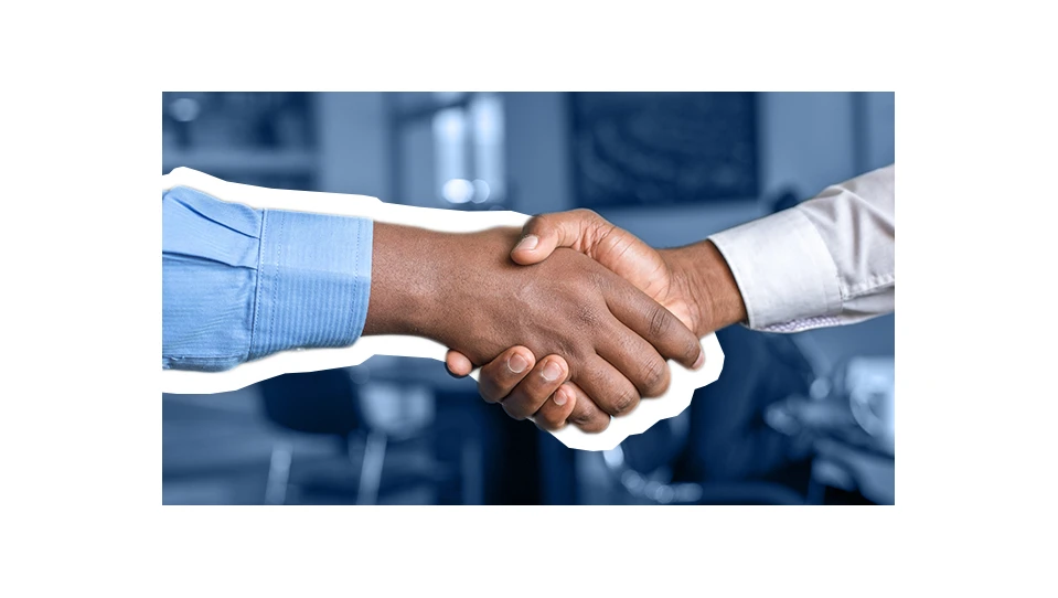 A photo of two people shaking hands