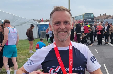 Kenny smiling after completing the Great North Run
