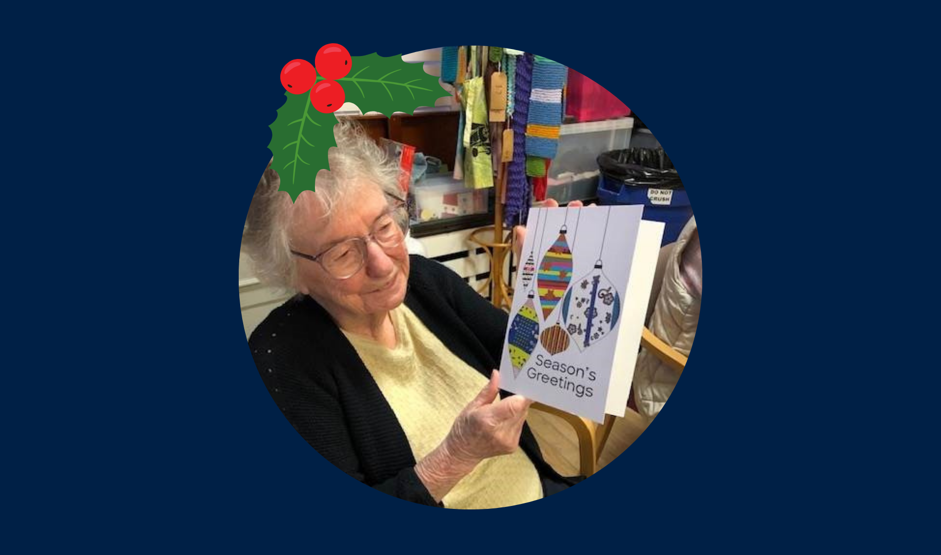 Blind veteran Joan wearing a Christmas hat, detailed with an illustration of holly.