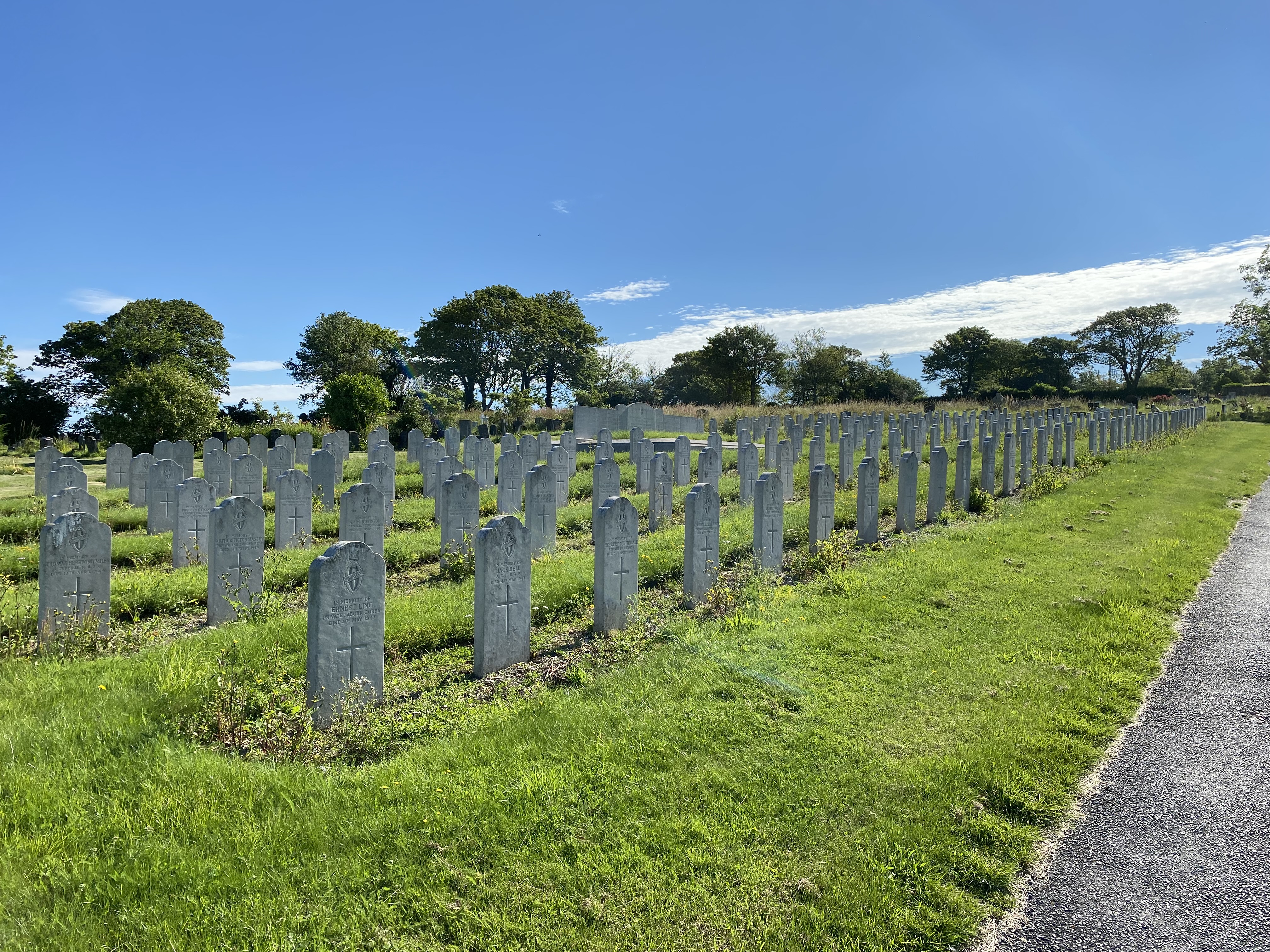 A photo of hundreds of graves in cemetery, pictured before they were restored