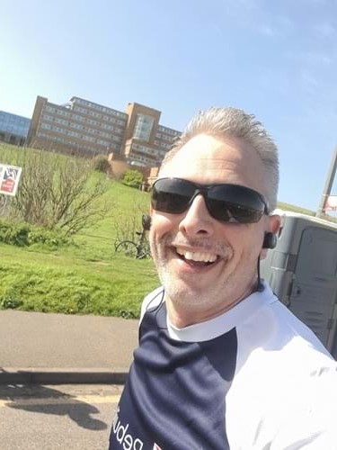 Stuart smiling as he passes the Ovingdean Centre