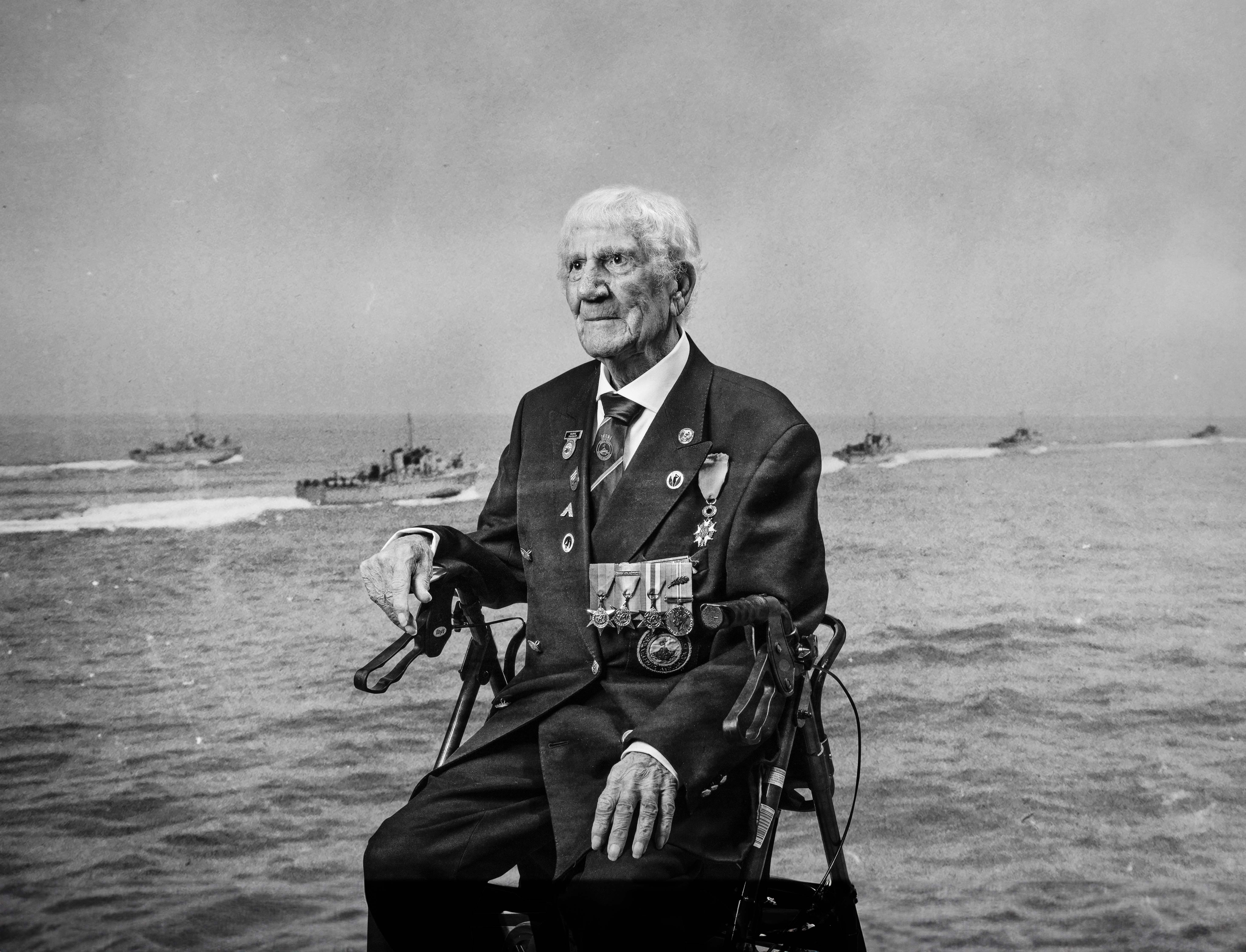 A black and white portrait of blind veteran George, overlaid on a scene from D-Day 