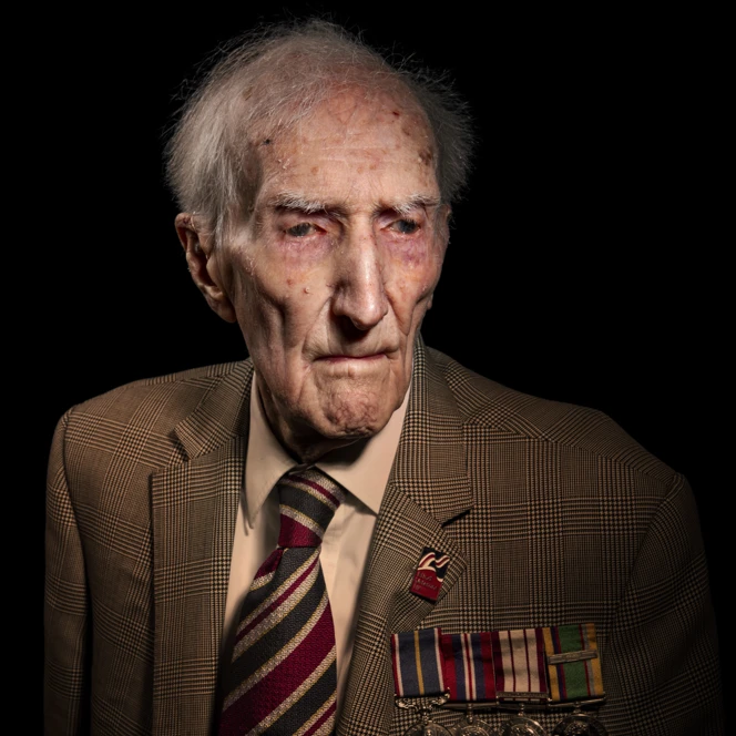 A portrait of Peter on a black background