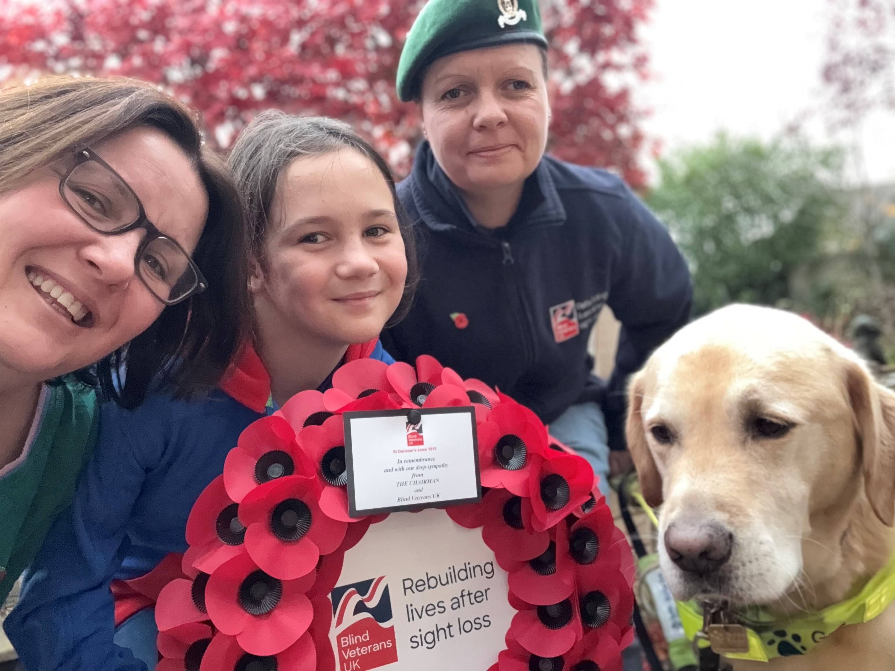 Kelly with her wife and their daughter have taken a selfie with Archie in their garden