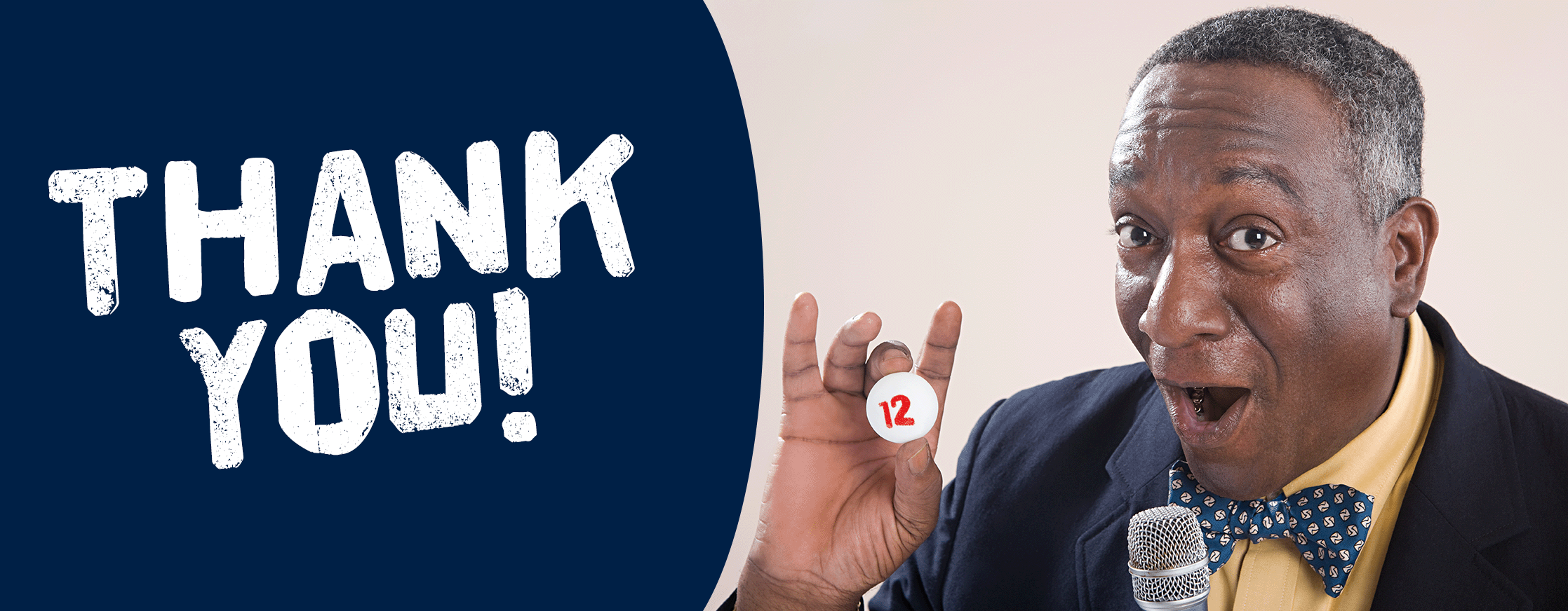 A photo of a bingo caller looking excited