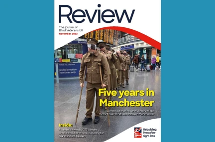 A magazine front cover with title "Five years in Manchester" and an image of our "living statue" made of blind veterans and volunteers in Piccadilly Station
