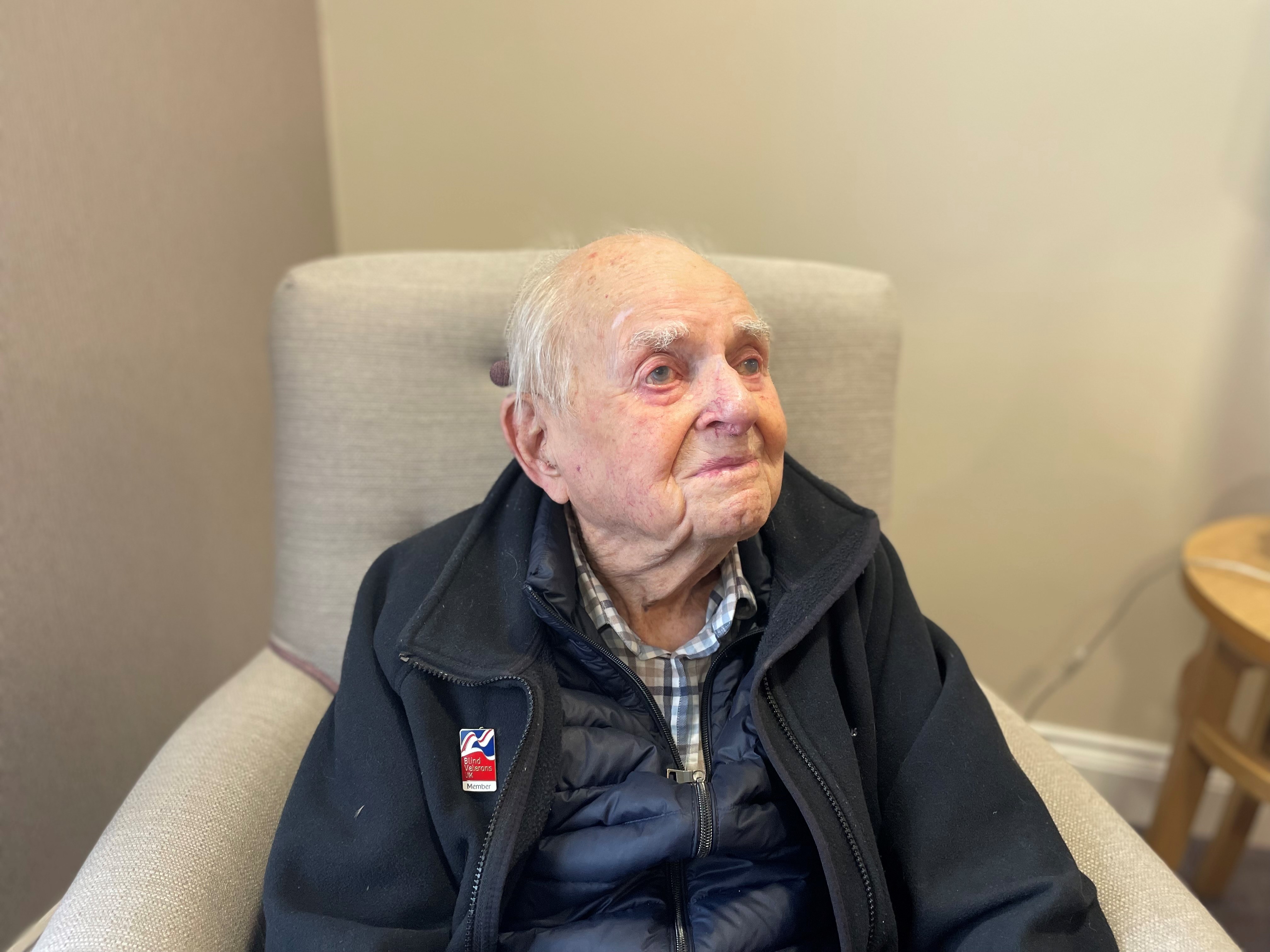 Mike Sadler today sitting in an arm chair and looking into the distance