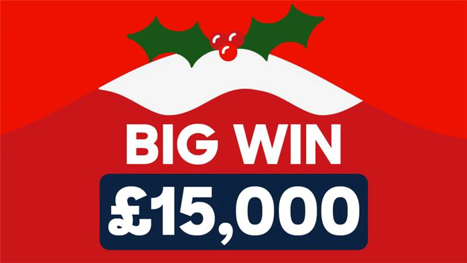 Christmas pudding with holly on top and text underneath 'big win £15,000'