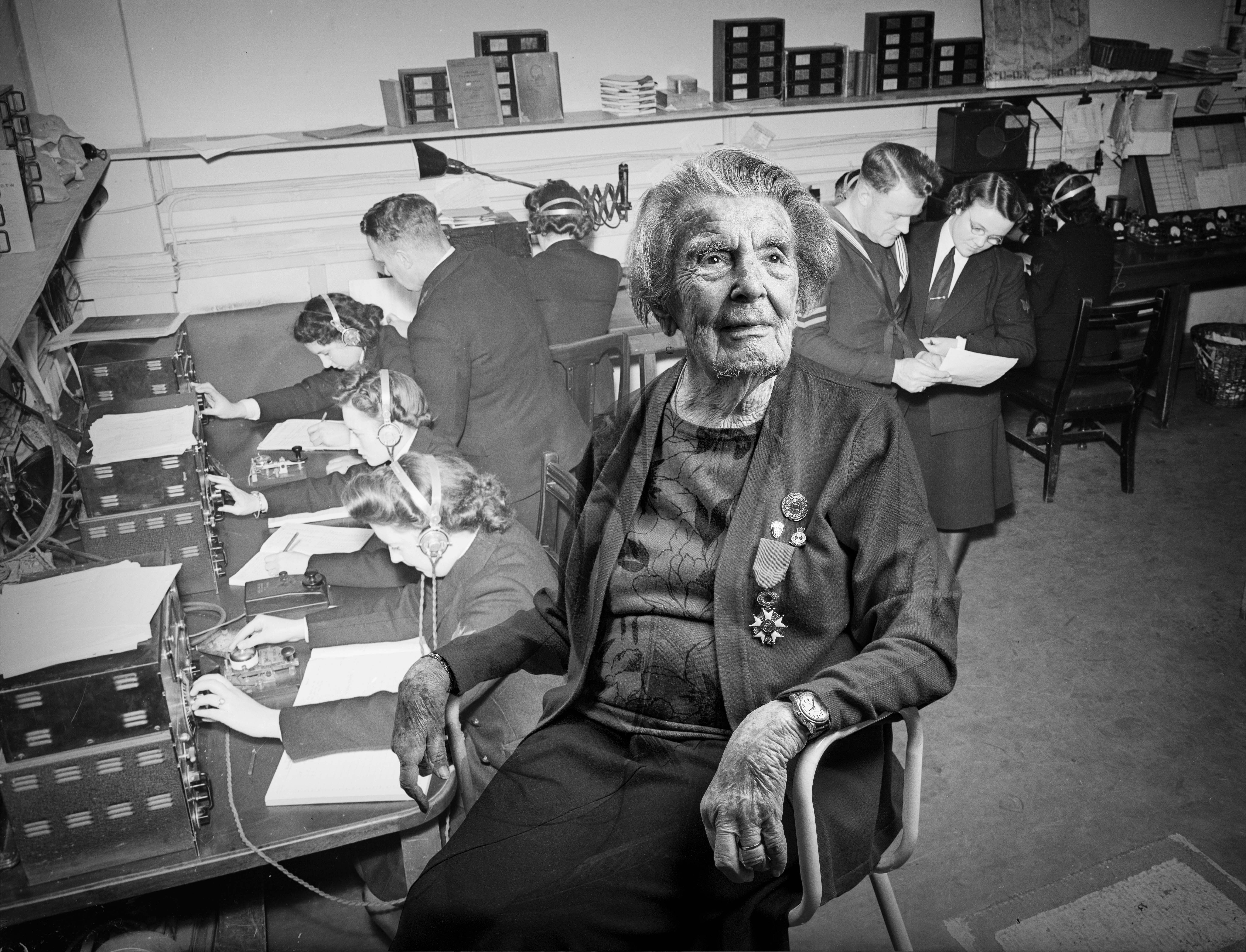 A black and white portrait of blind veteran Peggy, overlaid on a scene from WWII