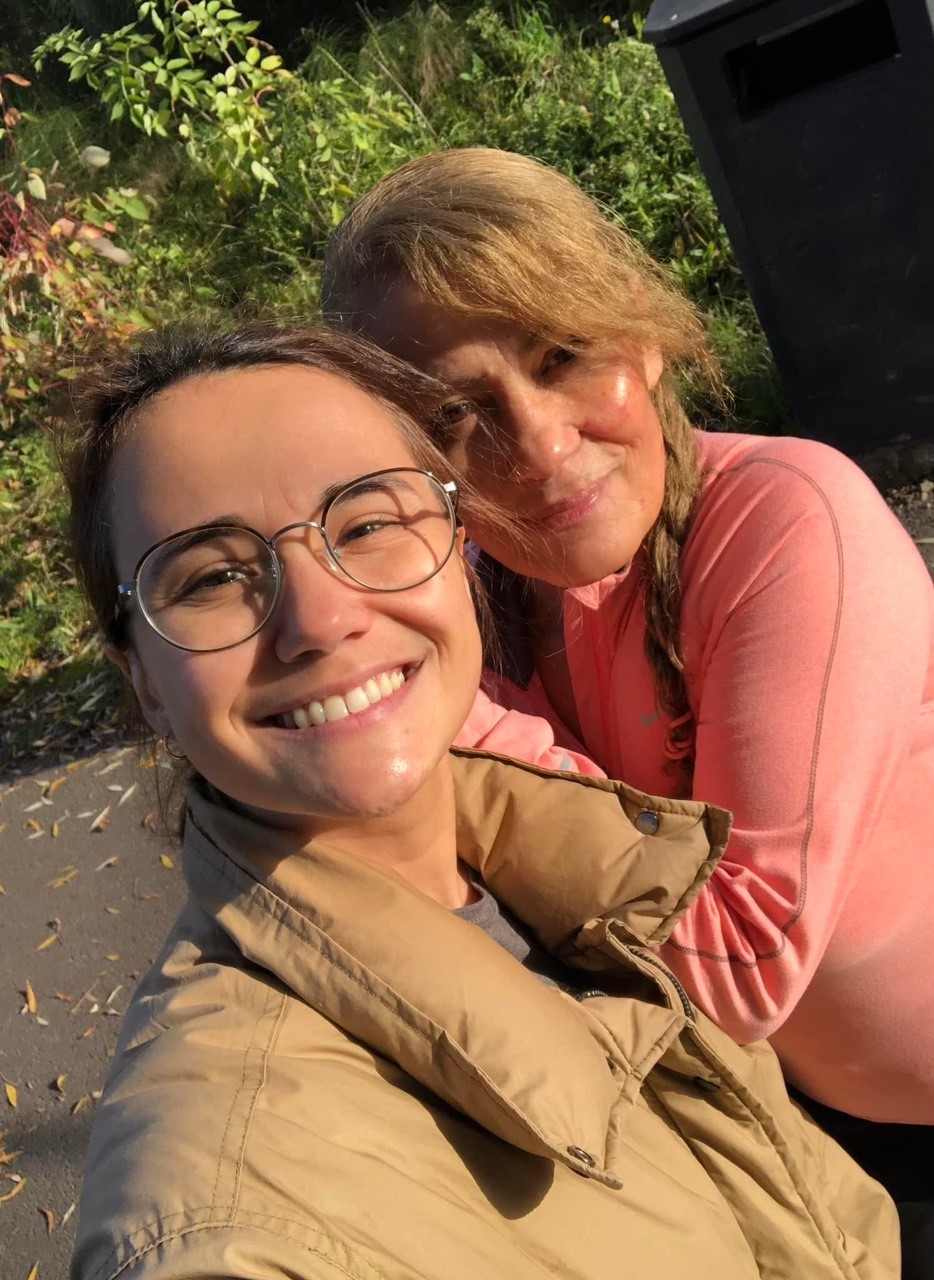 A close-up of Emilia and Kim standing next to each other