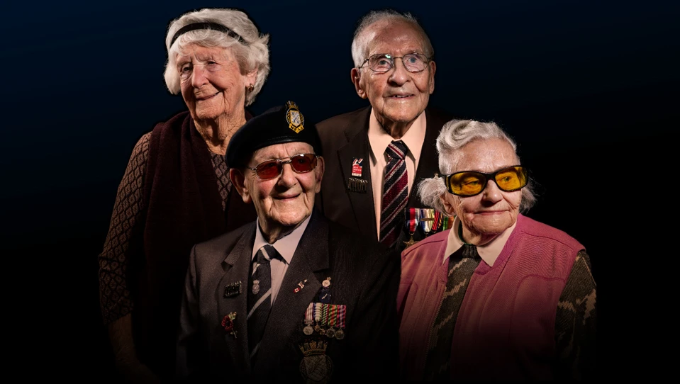 Four blind veterans edited alongside one another in a dark background.