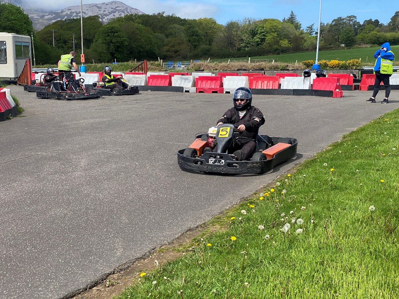 Chris driving around a track in a go-kart