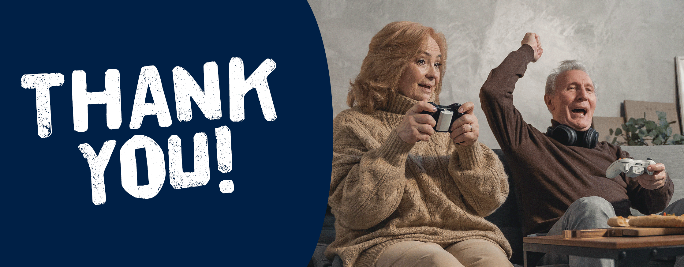 A photo of an older couple playing video games together