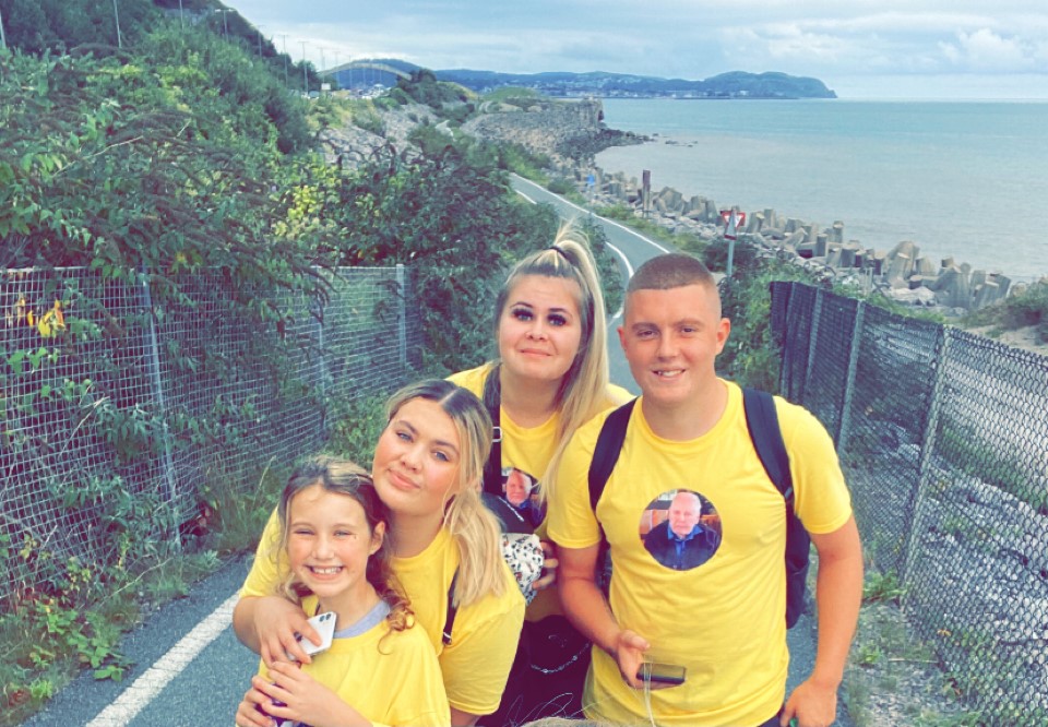 Griff's great grandchildren smiling wearing memorial t-shirts