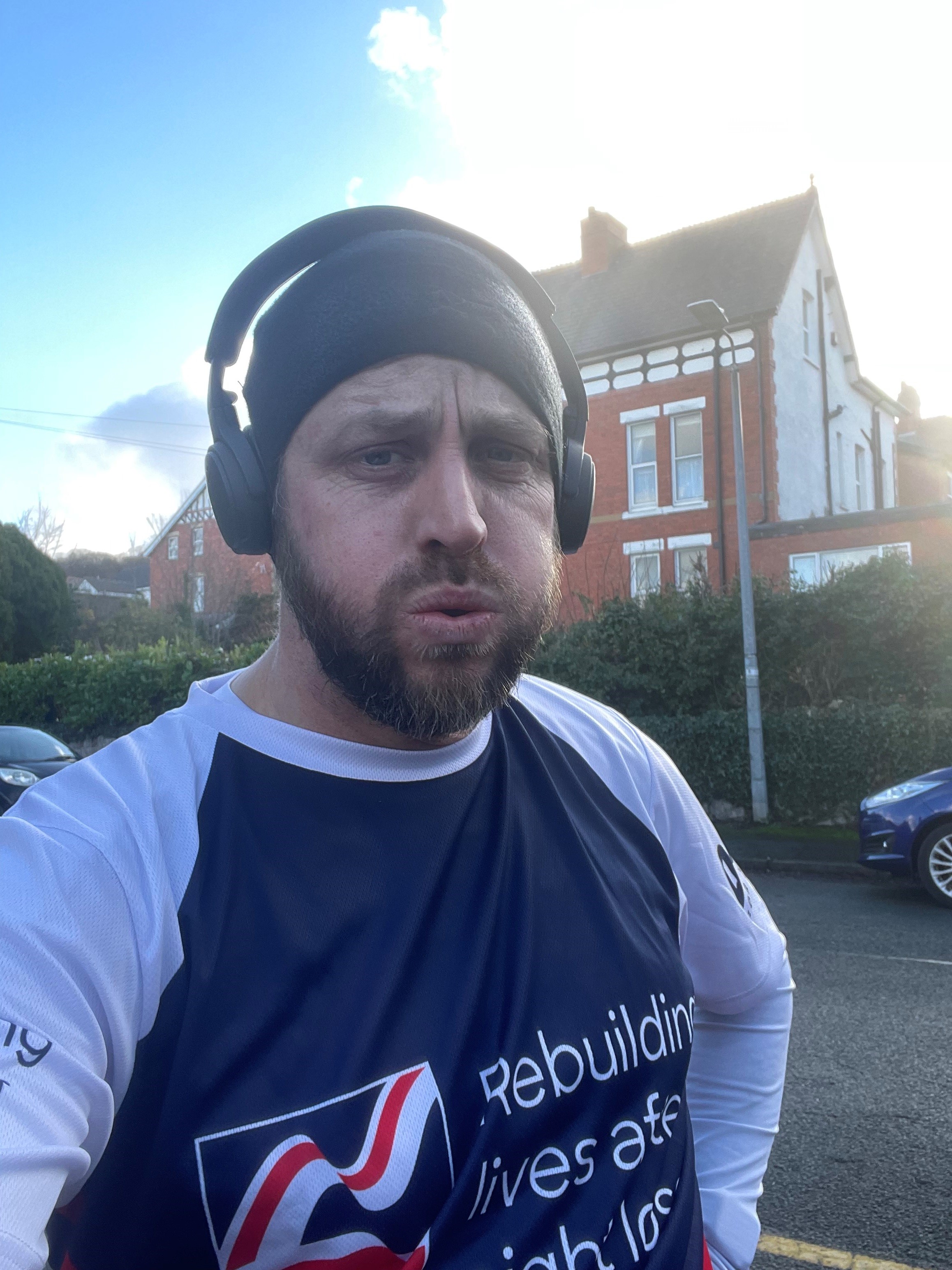 Matt at the end of a training run wearing a Blind Veterans UK t shirt 
