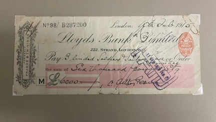 A cheque dated 10 February 1915 signed by Sir Arthur Pearson, for the amount of £6,000. The cheque is made out to "Blinded Soldiers & Sailors". The document has visible stamps and handwritten details.