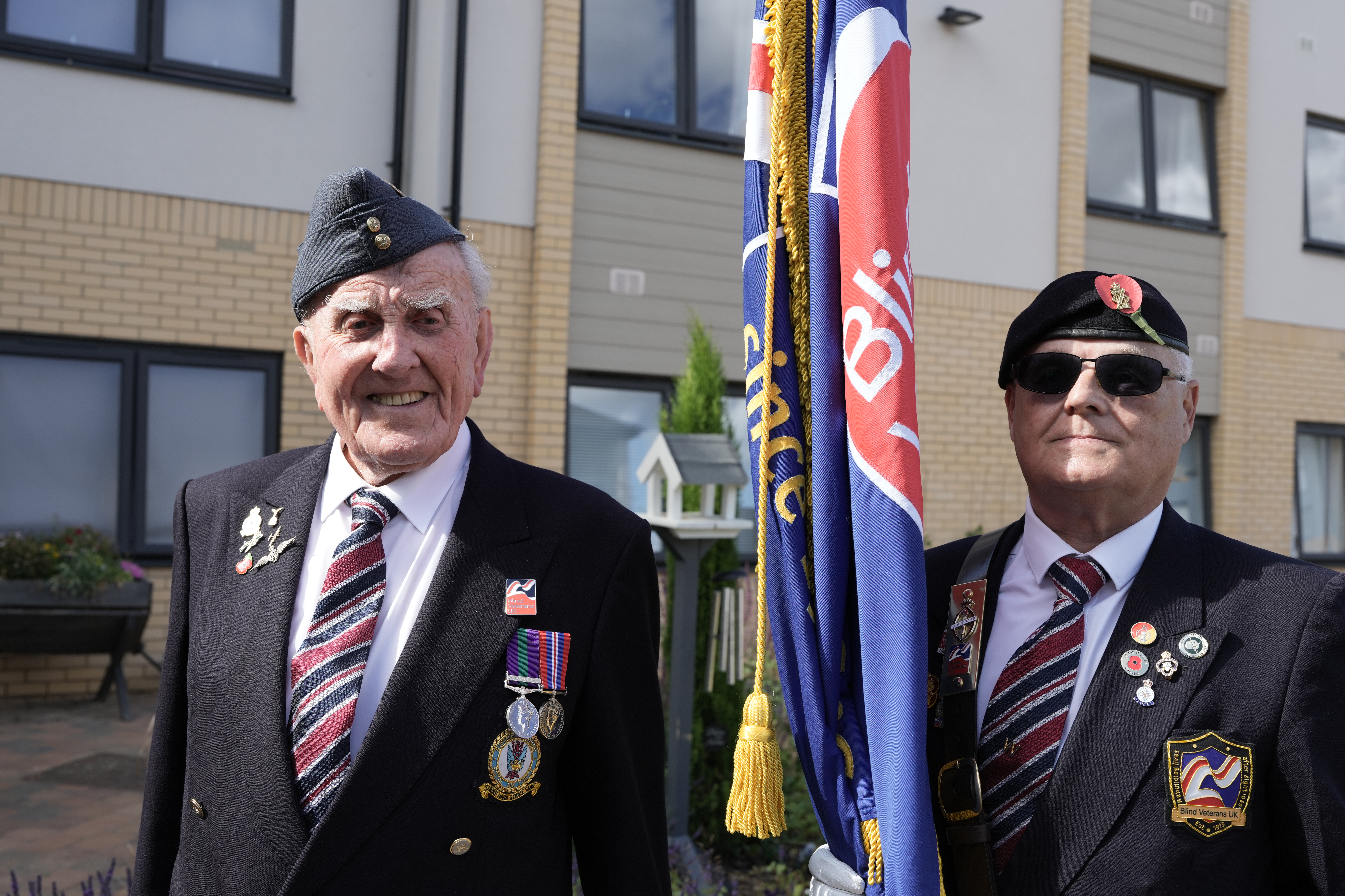 Michael and Wayne with standard - Remembrance 2025