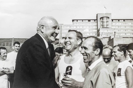 Former Chairman Lord Ian Fraser laughing with a group of blind veterans on the grounds of our Brighton Centre