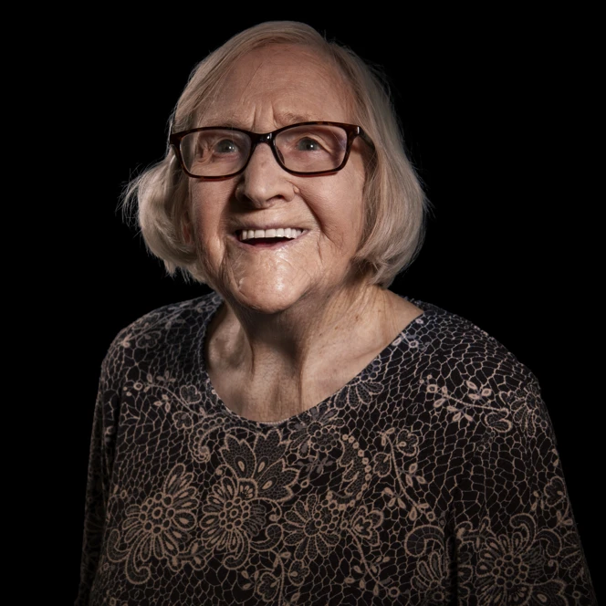 A portrait of Joan on a black background
