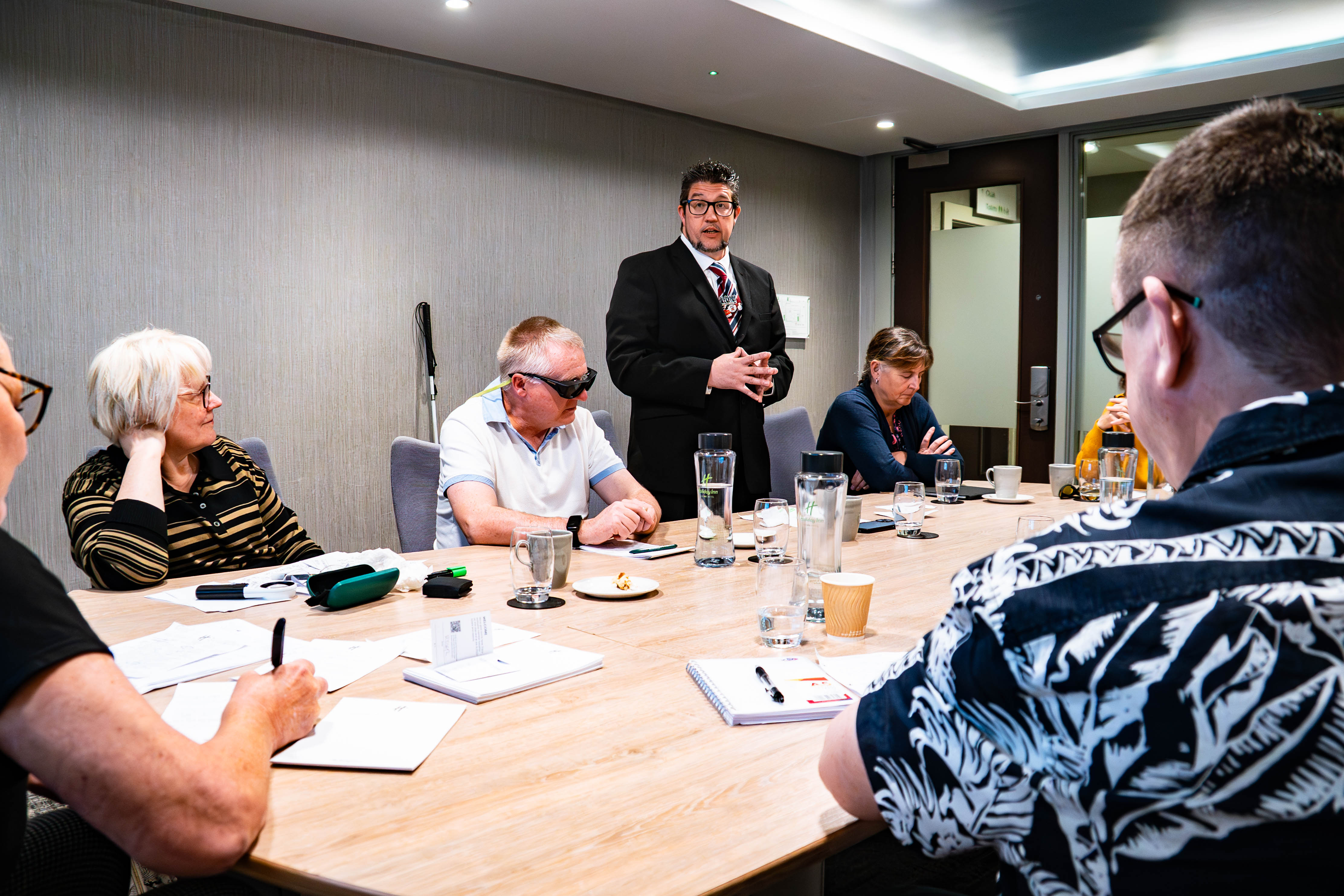 Blind veteran Wayne speaking at Ambassador training