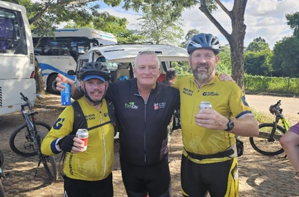 Colin stood between two of the guides that led the challenge. All in cycling shorts and cycling tops