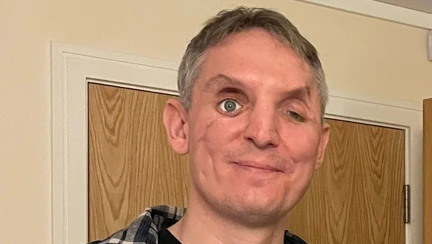 Ben stood smiling