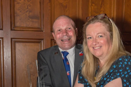 Blind veteran Billy, left, and Kathy, Centre Manager, right, cutting into a Blind Veterans UK cake