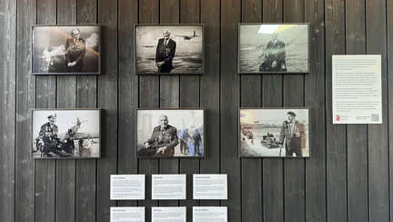 Six black and white portraits of blind D-Day veterans on display at the Winston Churchill Centre in Normandy