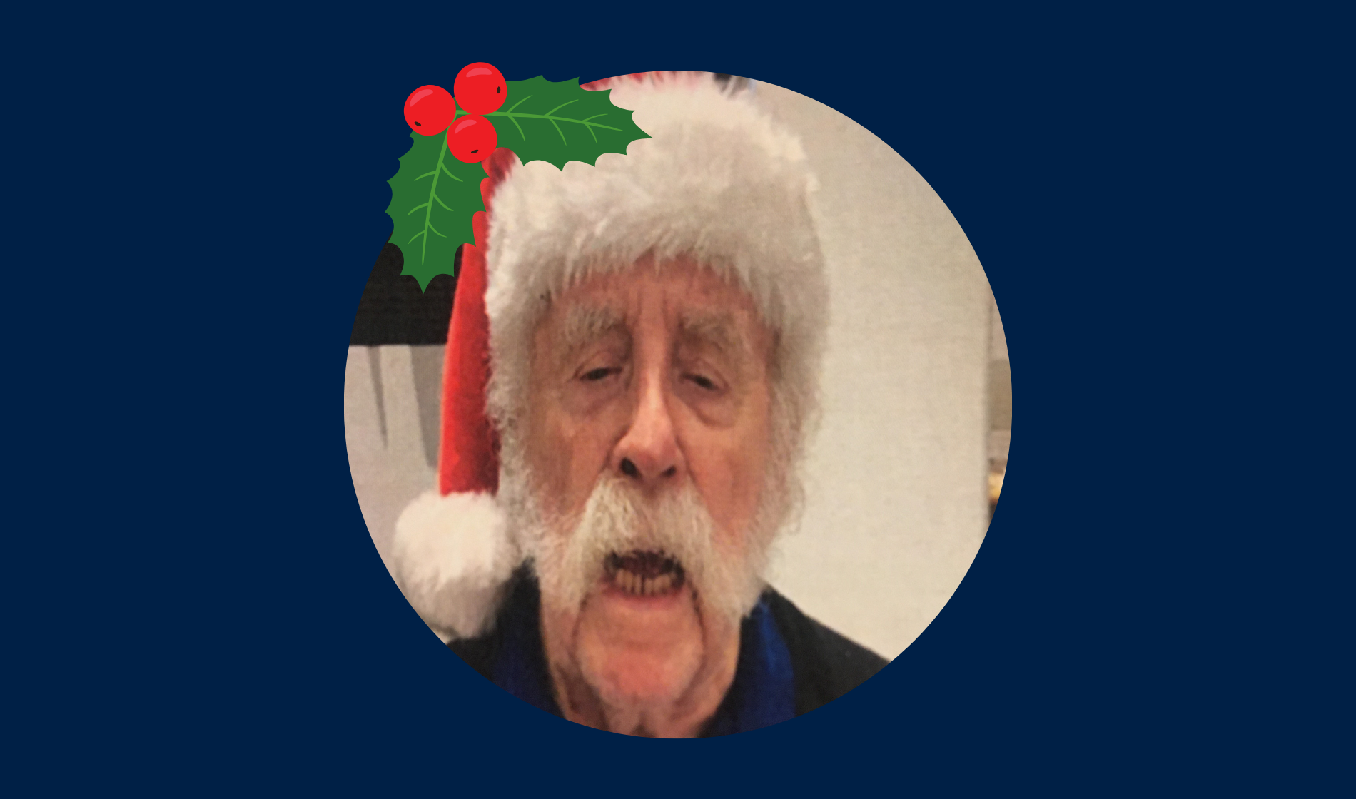 Blind veteran Eric wearing a Christmas hat, detailed with an illustration of holly.