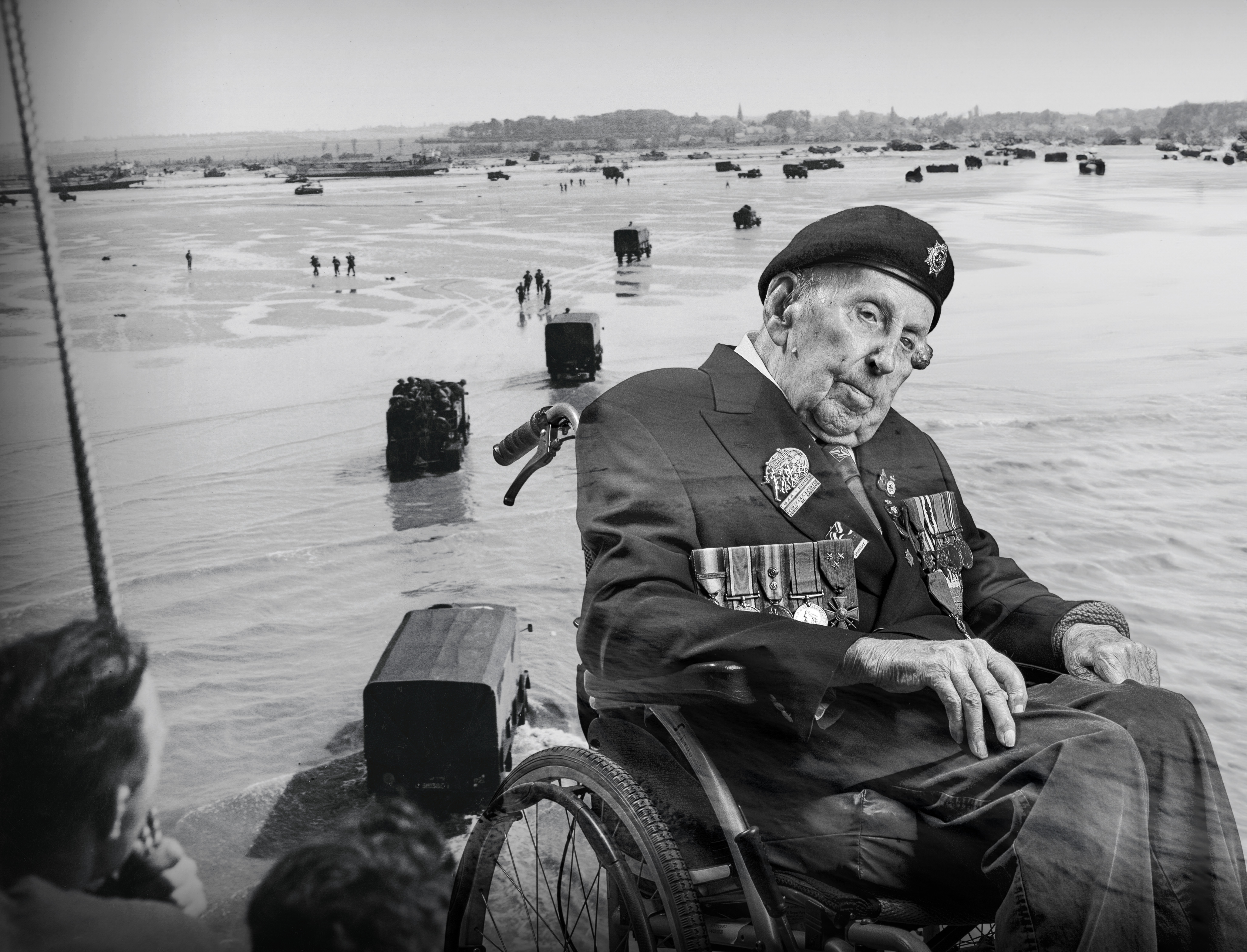 A black and white portrait of Ken, overlaid on a D-Day scene