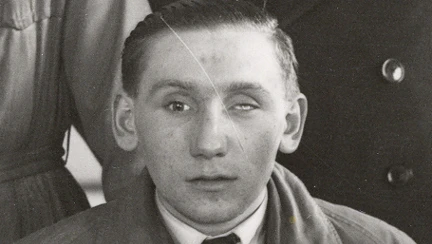 A black and white photograph of a young blind veteran Fred during his days of military service