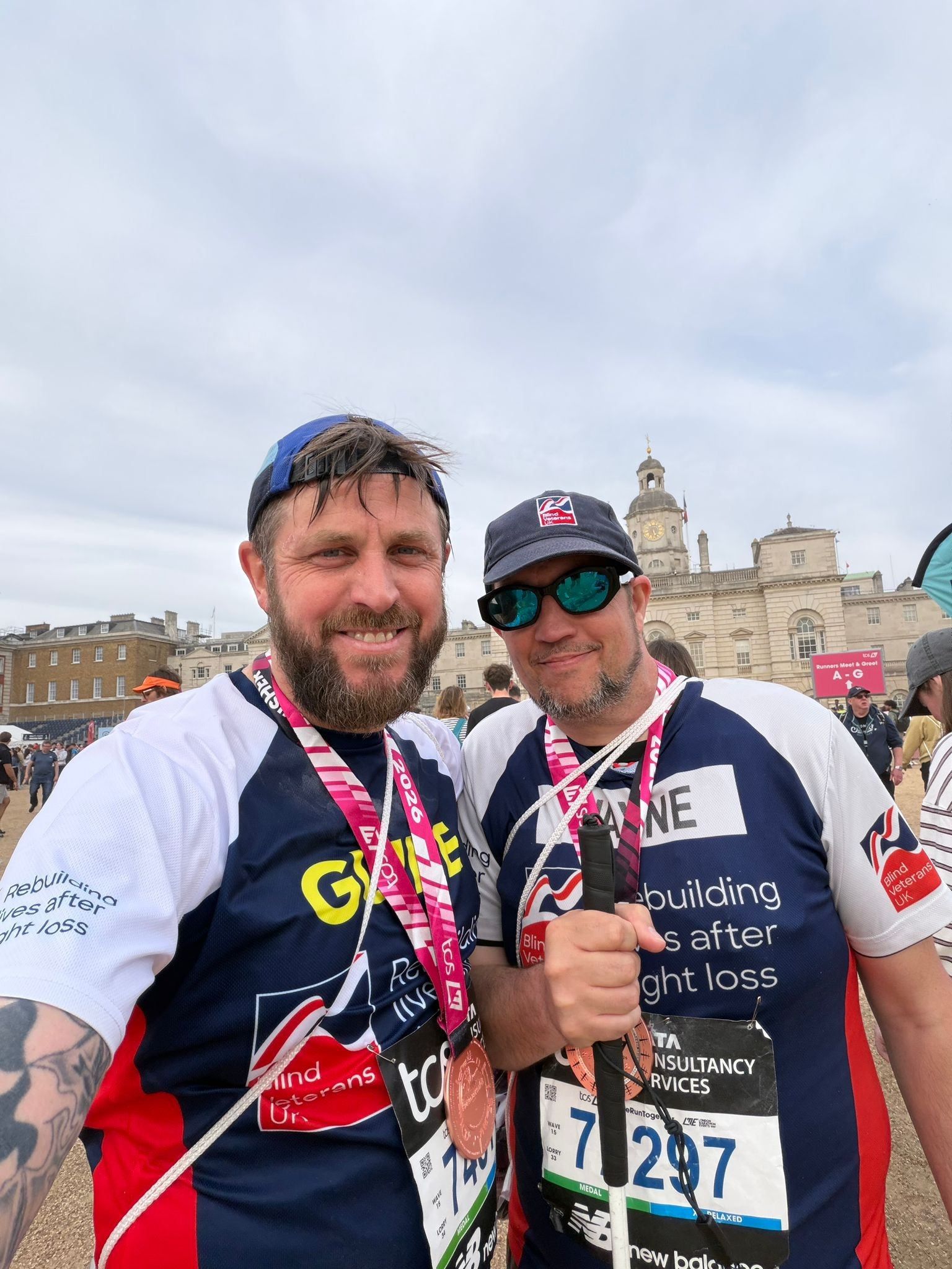 Wayne and Matt stand together with their London Marathon 2026 medals