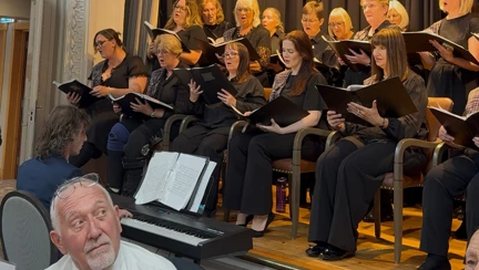A guest listening to the choir