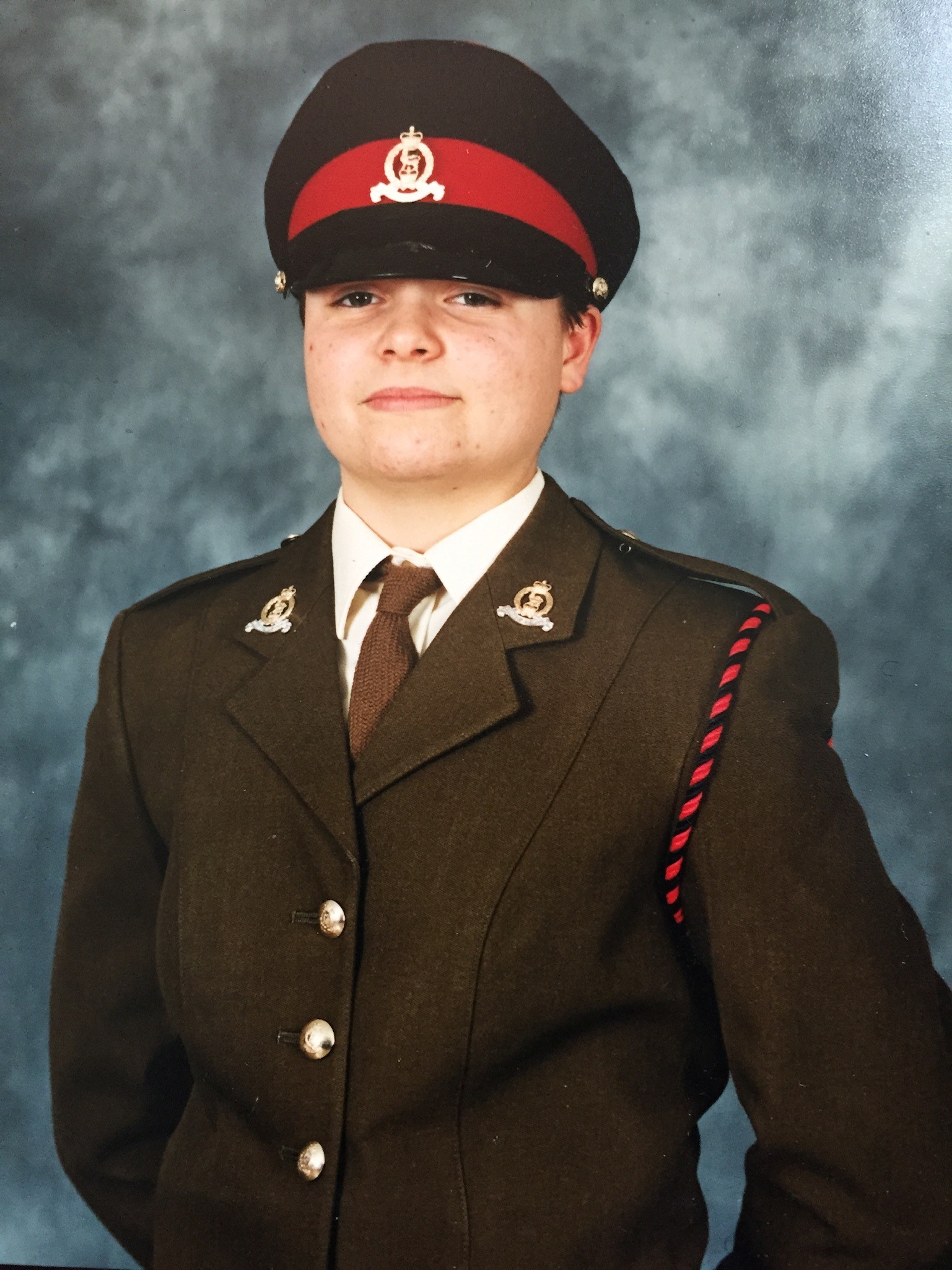 A portrait of Kelly in Army uniform.