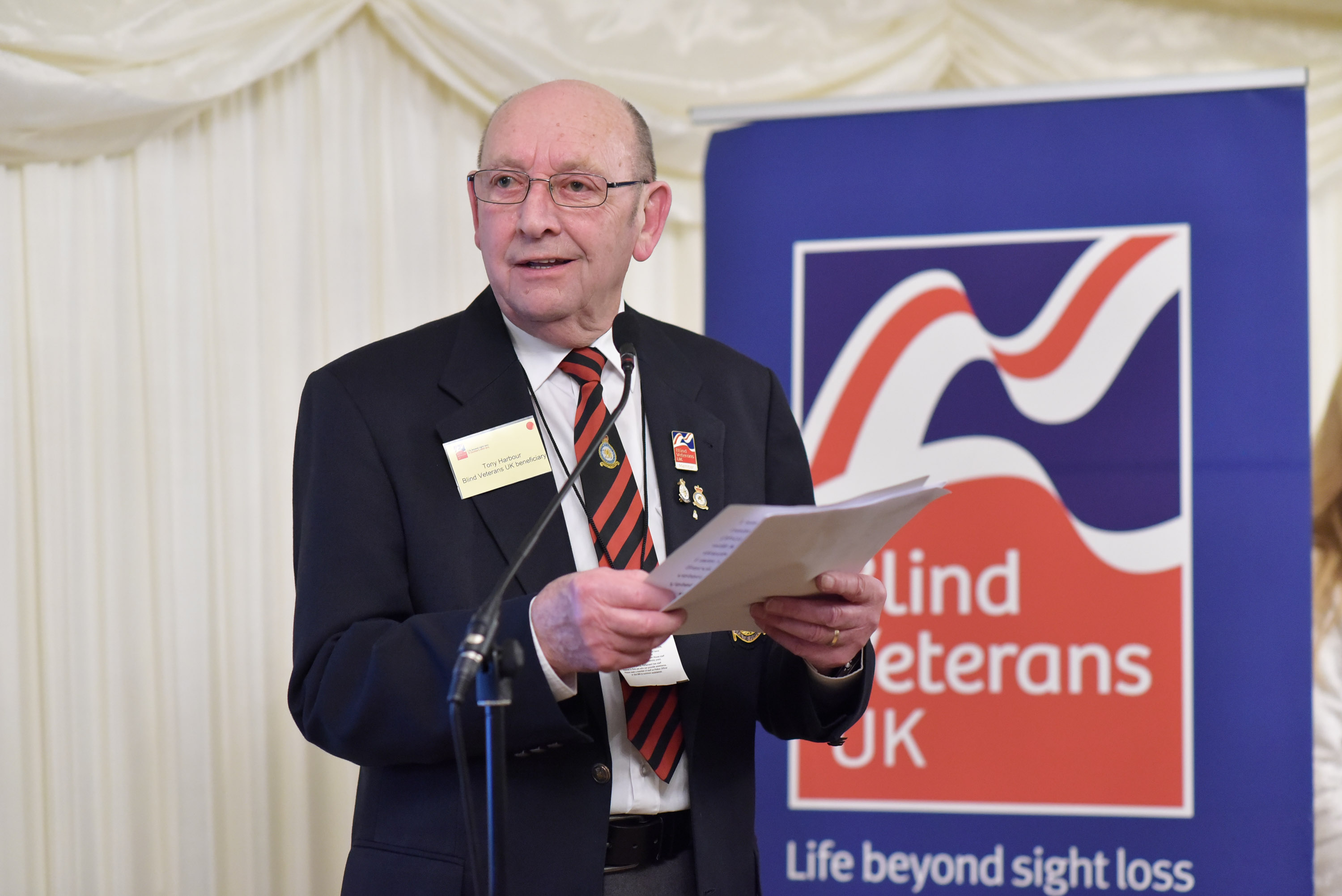 blind veteran talking at a conference