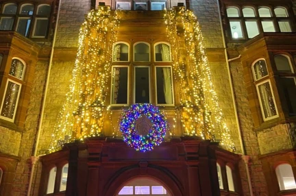 Christmas lights above the doorway at the entrance to the Llandudno centre