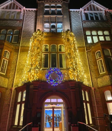 Christmas lights above the doorway at the entrance to the Llandudno centre