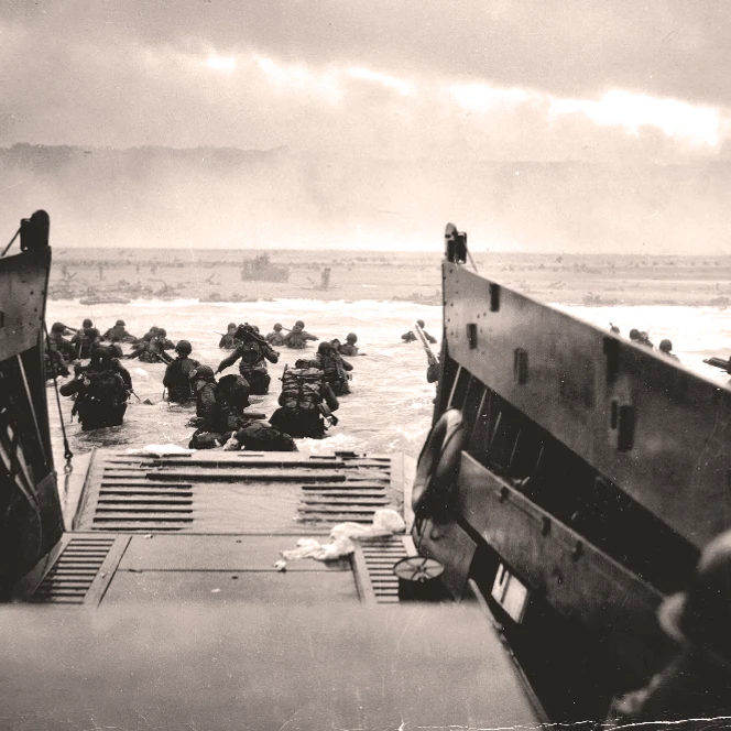 A LCVP from the US Coast Guard disembarks troops of the U.S. army's first division on the morning of D-Day