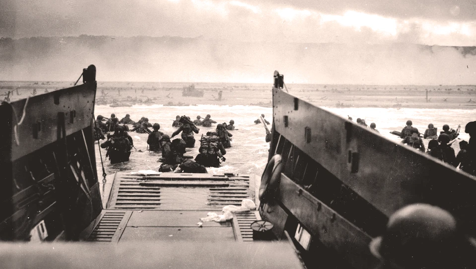 A LCVP from the US Coast Guard disembarks troops of the U.S. army's first division on the morning of D-Day
