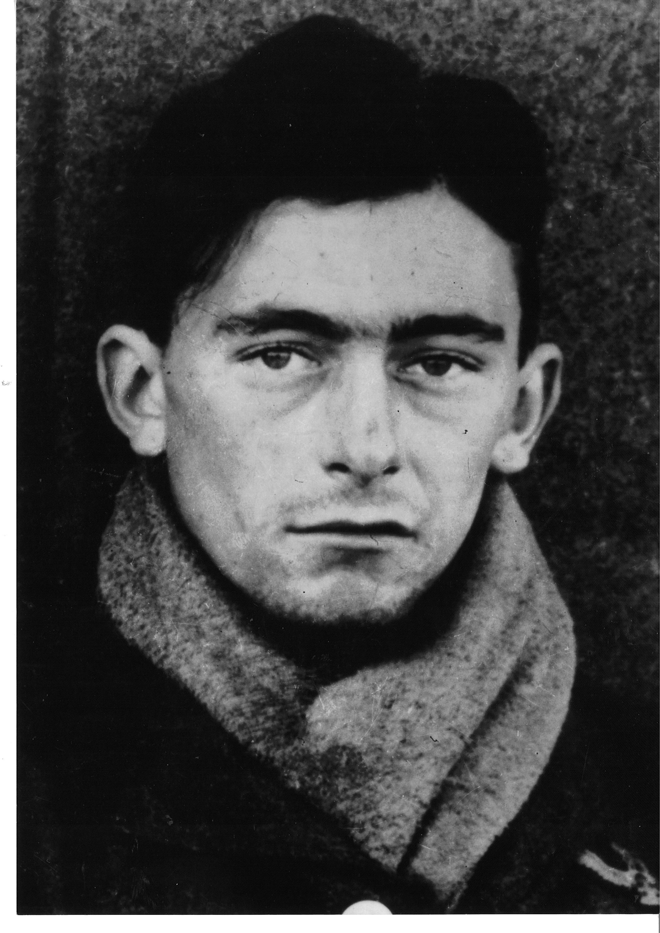 A black and white close-up of a young blind veteran Jim during the war