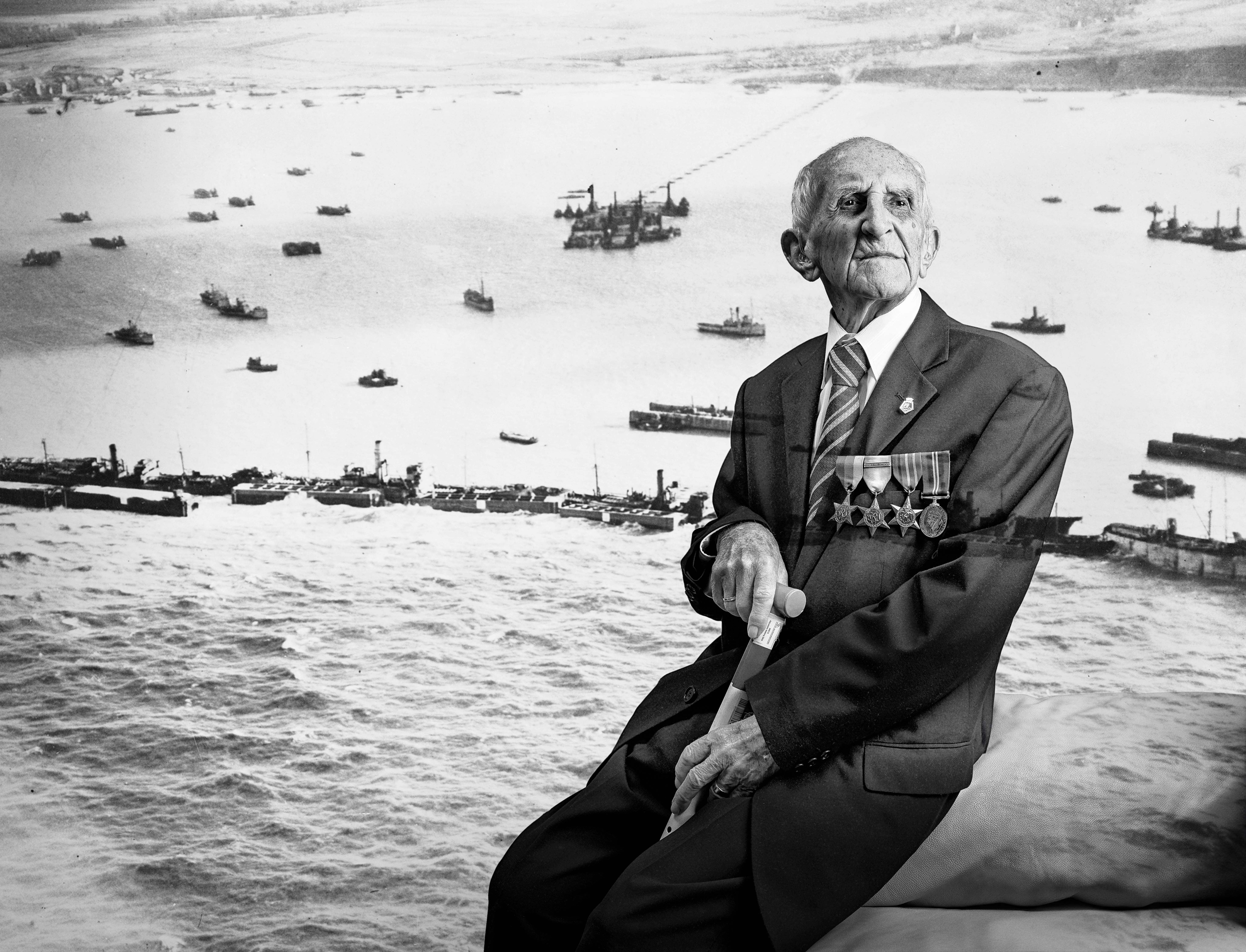 A black and white portrait of blind veteran Joe, overlaid on a scene from D-Day